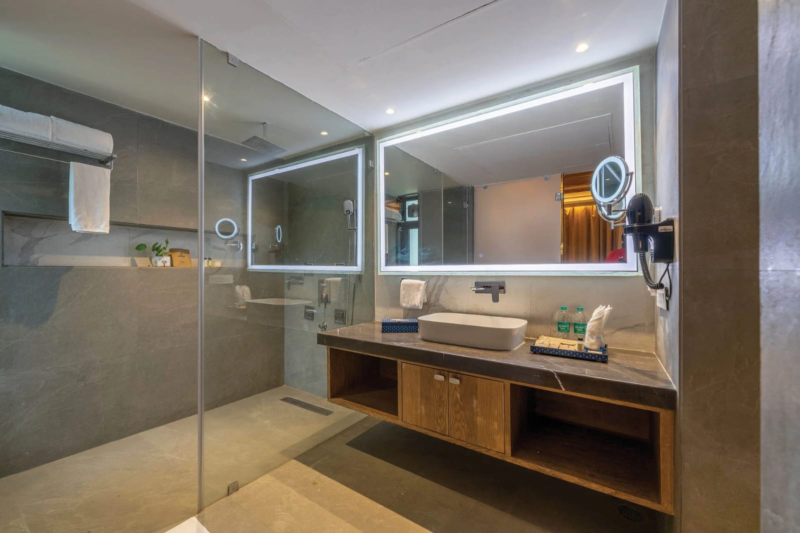 Luxury walk-in rain shower and marble vanity in a Kumbhalgarh resort bathroom