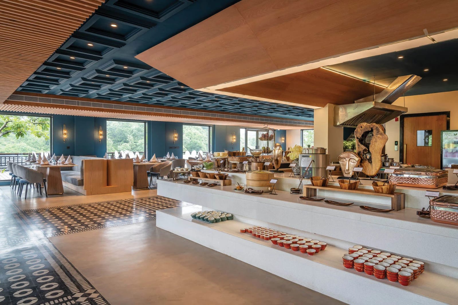 Luxury all-day dining restaurant with buffet and forest-facing windows
